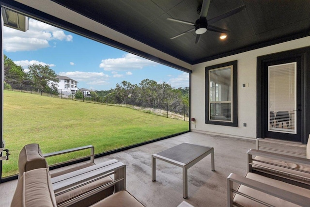 view of patio / terrace with ceiling fan and fence