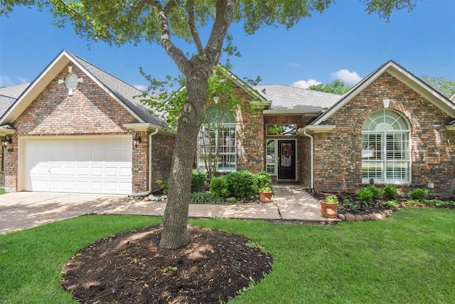 1312 Becca Teal Pl, Round Rock, TX 78681 - view of front of property with brick siding, a front yard, an attached garage, and driveway