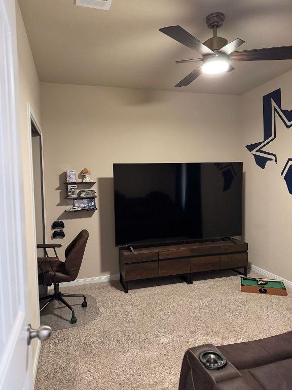 1045 Gaelic Dr, Georgetown, TX 78626 - living room featuring carpet flooring and a ceiling fan