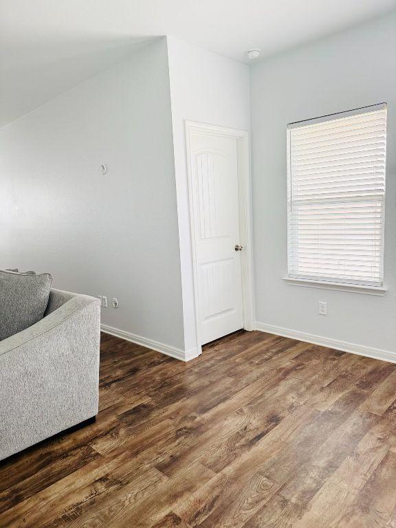1045 Gaelic Dr, Georgetown, TX 78626 - living area with wood finished floors and baseboards