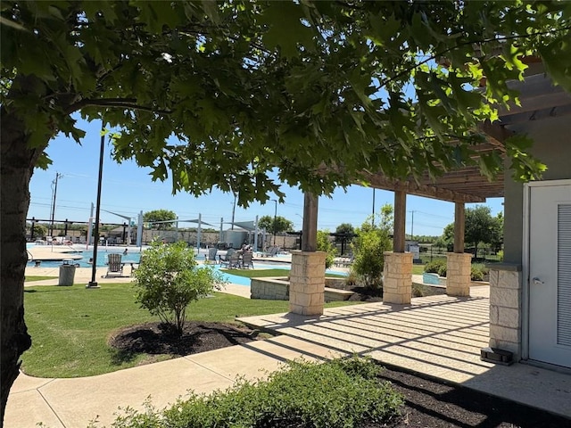 1045 Gaelic Dr, Georgetown, TX 78626 - view of home's community featuring a pool, a patio area, and a pergola