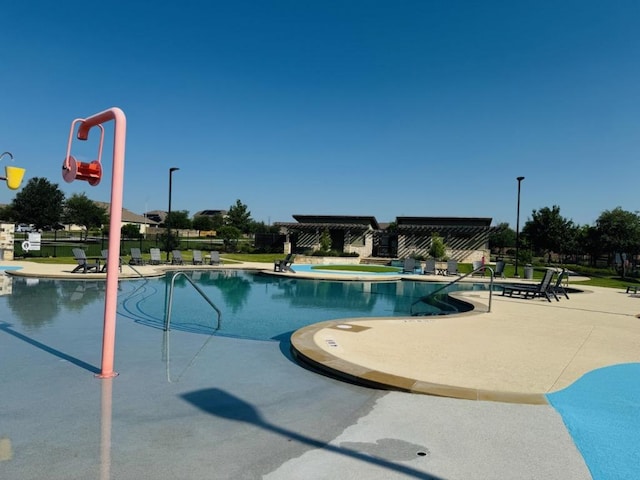 1045 Gaelic Dr, Georgetown, TX 78626 - community pool featuring a patio