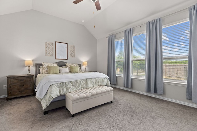 carpeted bedroom featuring a ceiling fan, baseboards, and vaulted ceiling