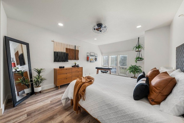 bedroom featuring recessed lighting, baseboards, and light wood-type flooring