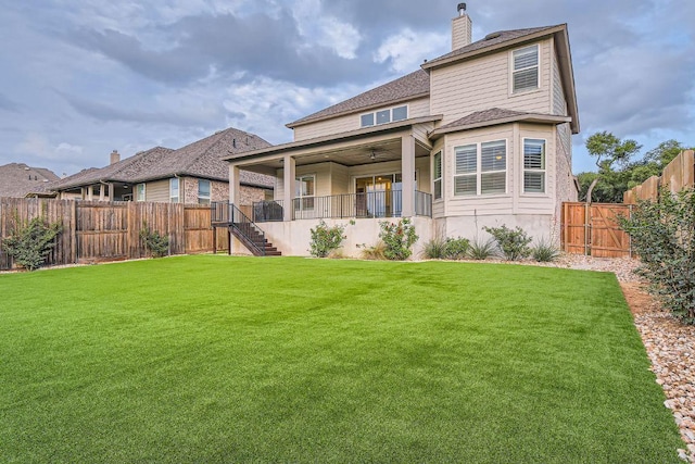 6914 Halesboro Dr, Austin, TX 78736 - rear view of house featuring a lawn, a chimney, a fenced backyard, and stairs