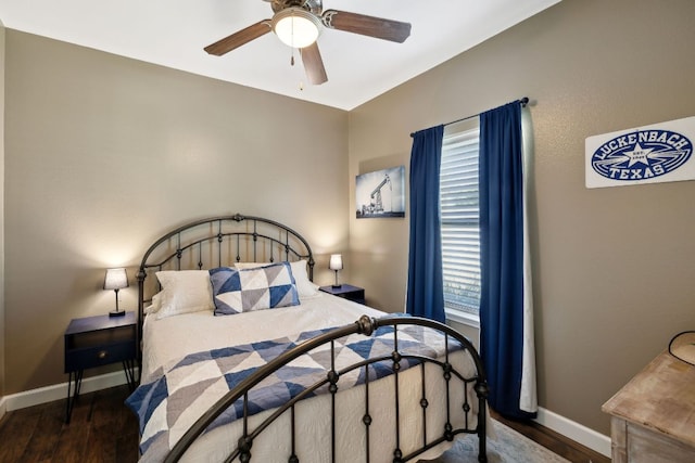 bedroom with baseboards, ceiling fan, and wood finished floors