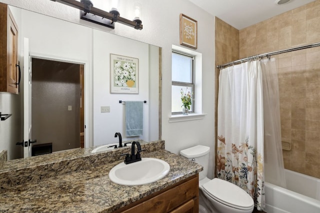 full bathroom featuring toilet, shower / tub combo with curtain, and vanity