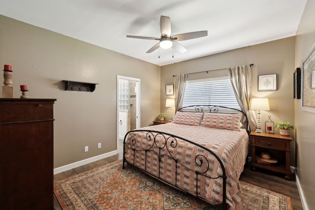 bedroom featuring baseboards, ceiling fan, and wood finished floors
