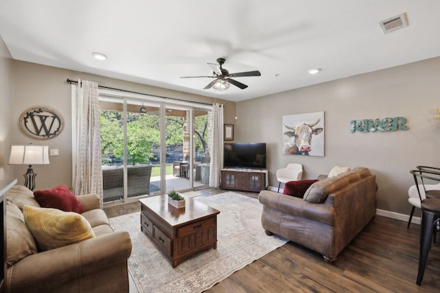 living area featuring recessed lighting, a ceiling fan, baseboards, and wood finished floors