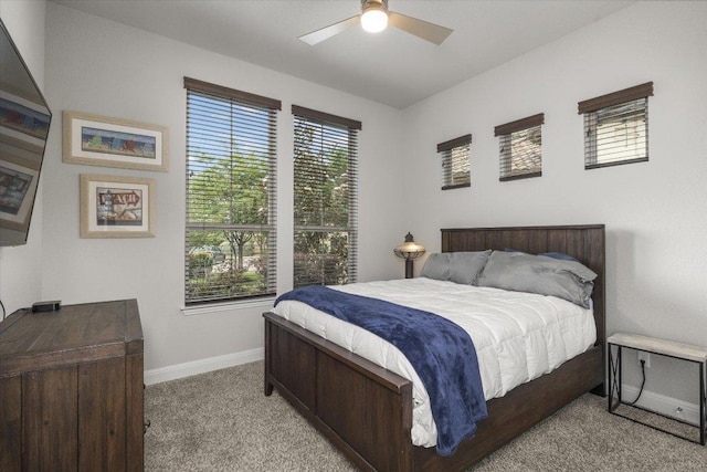 bedroom featuring baseboards, carpet flooring, and ceiling fan