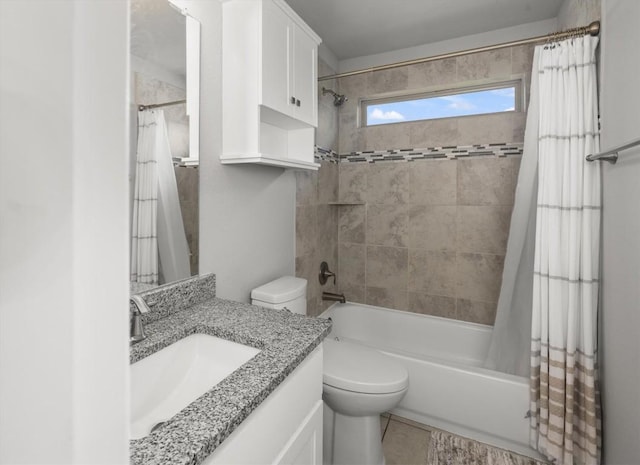 full bath featuring vanity, tile patterned flooring, shower / bath combo with shower curtain, and toilet