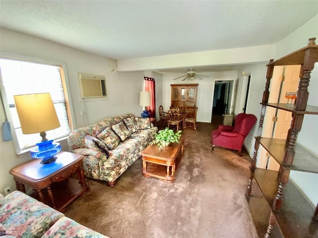living area featuring carpet flooring, ceiling fan, and a wall mounted air conditioner