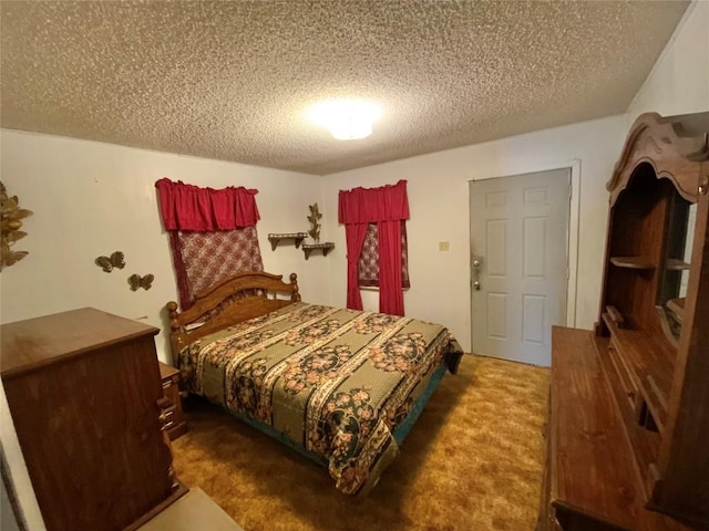 carpeted bedroom with a textured ceiling