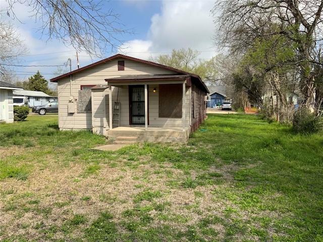 back of house featuring a porch