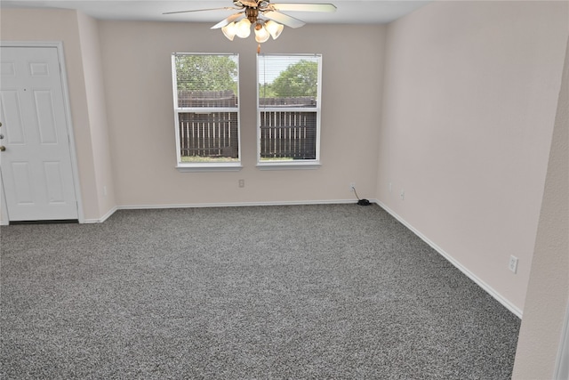 unfurnished room with carpet floors, ceiling fan, and baseboards