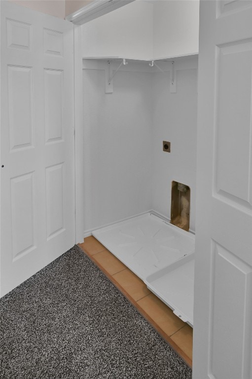 washroom with electric dryer hookup and laundry area