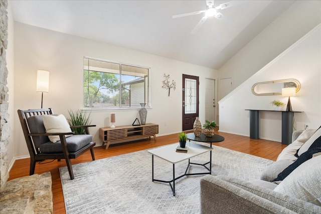 living room with ceiling fan, wood finished floors, a healthy amount of sunlight, and high vaulted ceiling
