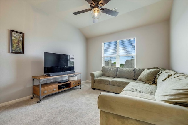 living area with a ceiling fan, baseboards, light colored carpet, and vaulted ceiling