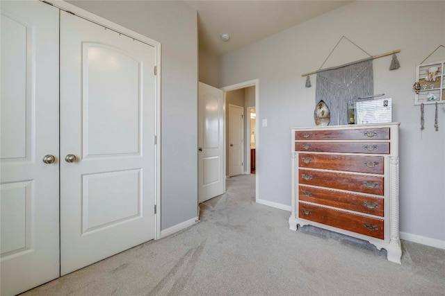 carpeted bedroom featuring baseboards