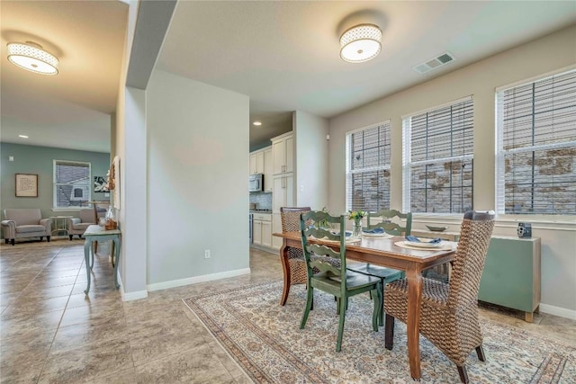 dining room with recessed lighting, baseboards, visible vents, and light tile patterned floors