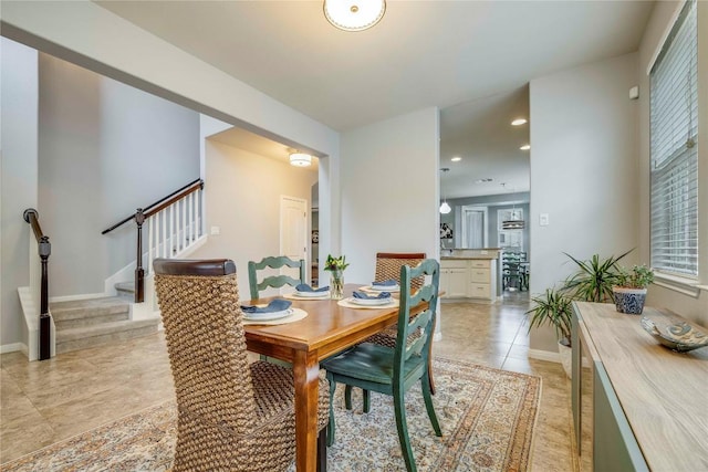 dining space featuring stairs, recessed lighting, baseboards, and light tile patterned floors