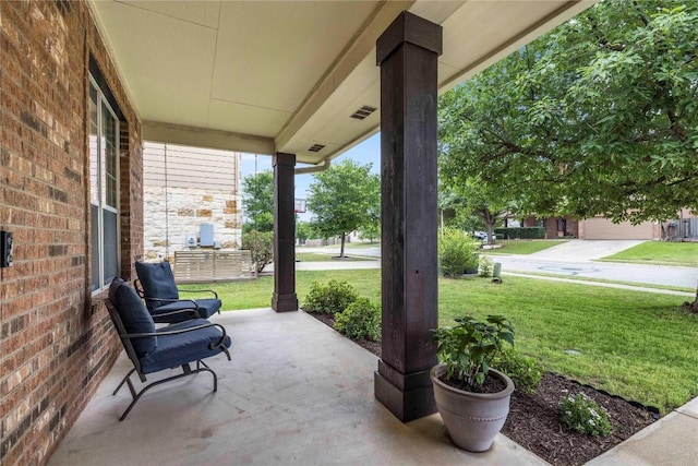 view of patio / terrace featuring visible vents and a porch