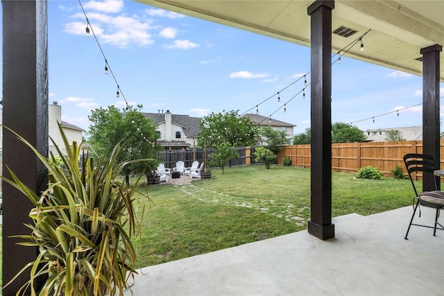 view of yard featuring a patio and a fenced backyard