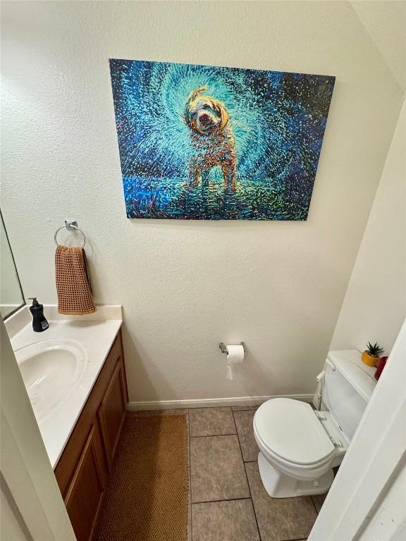 10608 Plains Trl Unit B, Austin, TX 78758 - bathroom with toilet, tile patterned flooring, vanity, and baseboards