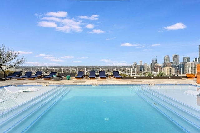 community pool with a city view