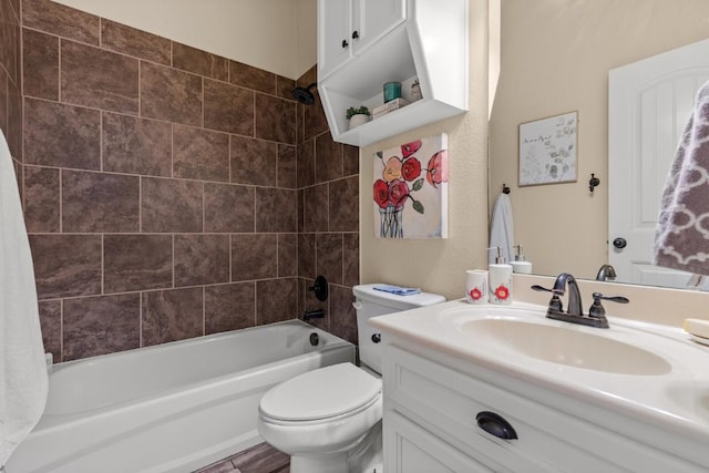 full bathroom featuring vanity, toilet, and tub / shower combination