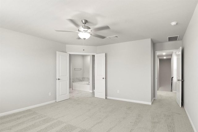 18305 Emu Ln, Manor, TX 78653 - unfurnished bedroom with light carpet, baseboards, and a ceiling fan