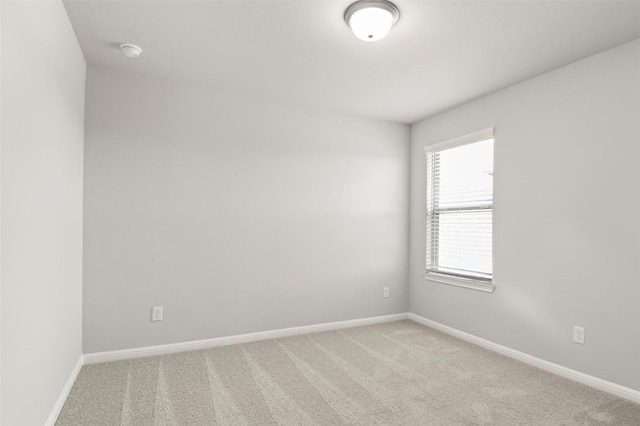 18305 Emu Ln, Manor, TX 78653 - unfurnished room featuring light carpet, baseboards, and a smoke detector