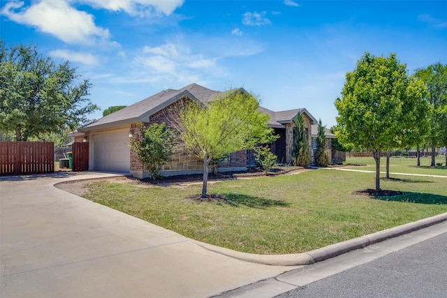 view of property hidden behind natural elements featuring fence, a front lawn, brick siding, a garage, and driveway