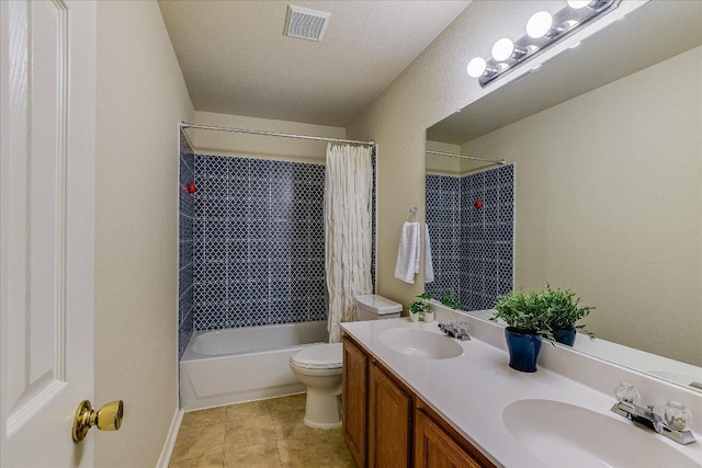 full bath with double vanity, toilet, visible vents, and a sink