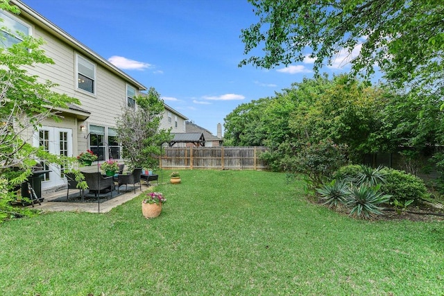 view of yard with a fenced backyard, a patio area, and an outdoor hangout area