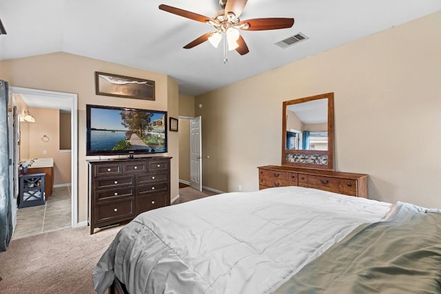 carpeted bedroom with baseboards, visible vents, ceiling fan, and vaulted ceiling