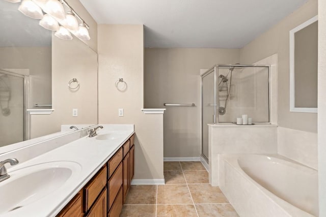 full bathroom featuring double vanity, a shower stall, a sink, and a garden tub
