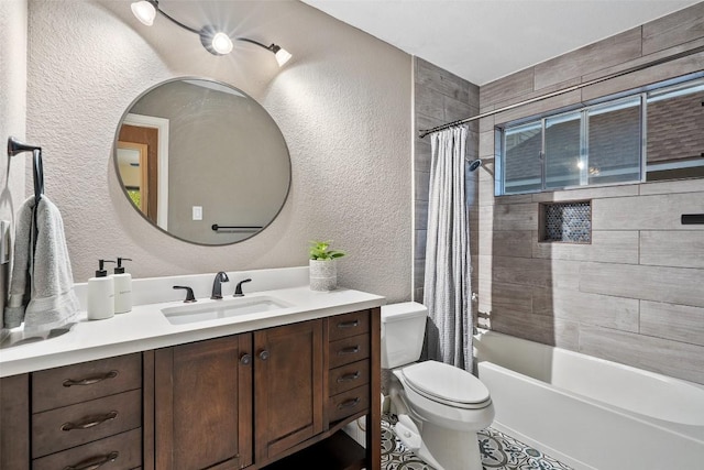 bathroom featuring vanity, a textured wall, shower / bath combo, and toilet