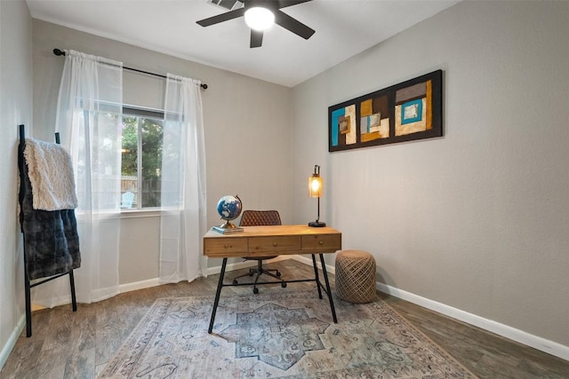 office featuring baseboards, ceiling fan, and wood finished floors