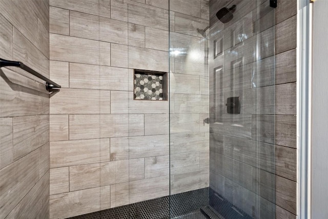 bathroom with tiled shower