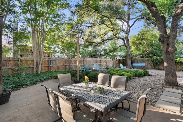view of patio / terrace featuring outdoor dining area and a fenced backyard