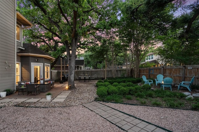 view of yard featuring fence and a patio area