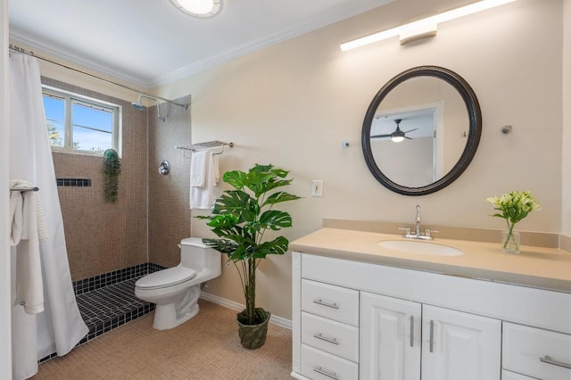 full bath featuring vanity, ornamental molding, toilet, ceiling fan, and a tile shower