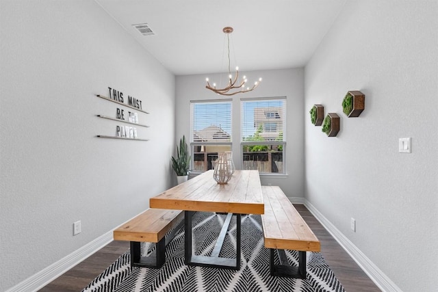 dining space featuring an inviting chandelier, baseboards, dark wood-style floors, and visible vents