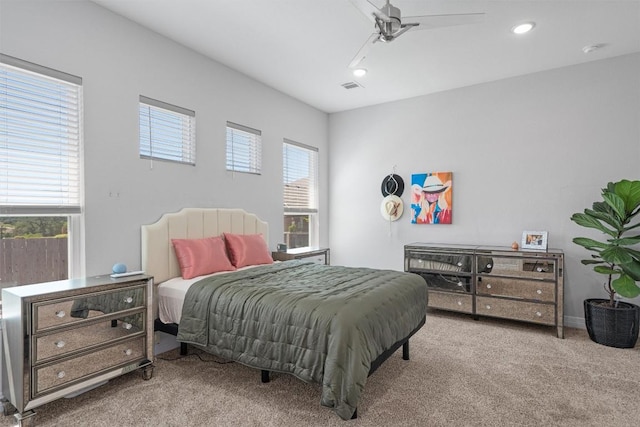 carpeted bedroom featuring visible vents, recessed lighting, and a ceiling fan