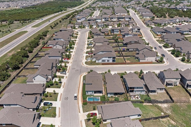 birds eye view of property with a residential view