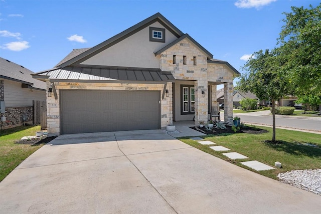 view of front of home featuring a standing seam roof, an attached garage, driveway, and stone siding