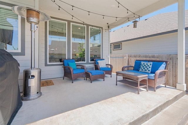 view of patio / terrace with fence and an outdoor hangout area