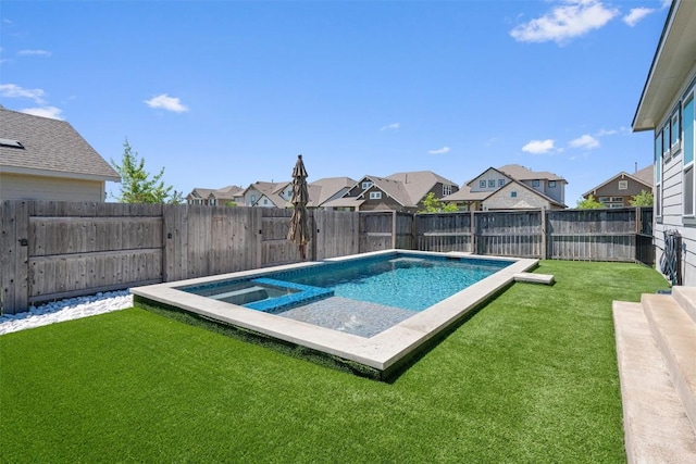 view of pool with a fenced backyard, a pool with connected hot tub, a yard, and a residential view