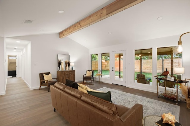 living room with visible vents, light wood-type flooring, baseboards, vaulted ceiling with beams, and recessed lighting